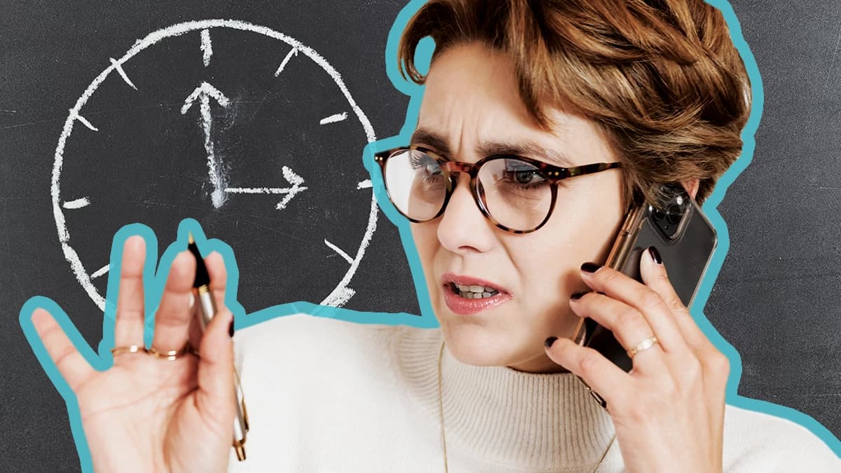 A woman on the phone in front of a clock