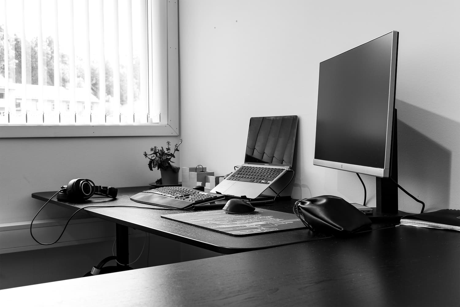 Monitor and a laptop on an office desk